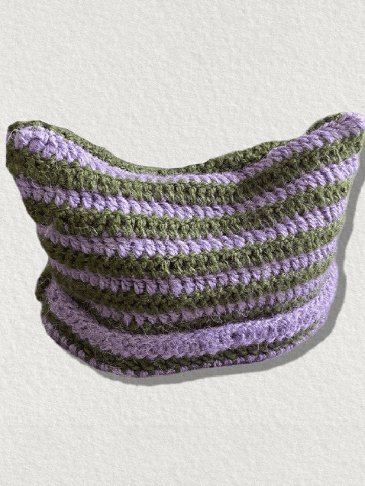 Striped knitted hat with handmade horn detail