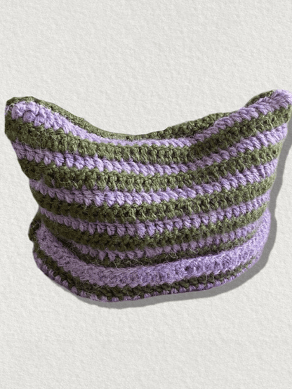 Striped knitted hat with handmade horn detail