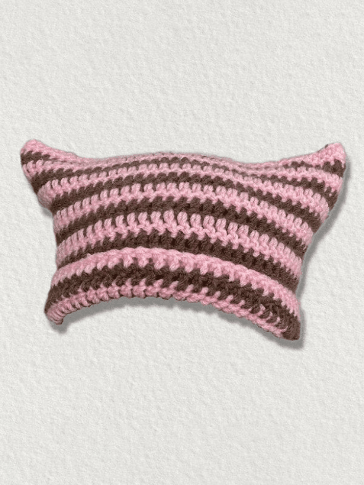 Striped knitted hat with handmade horn detail