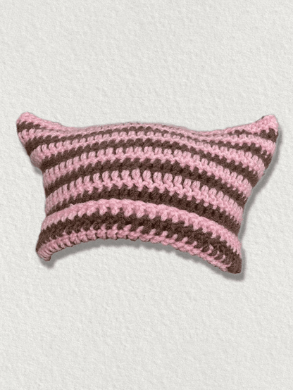 Striped knitted hat with handmade horn detail