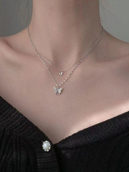 Double layer necklace with rhinestone butterfly pendant