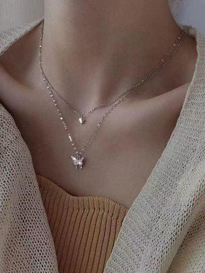 Double layer necklace with rhinestone butterfly pendant
