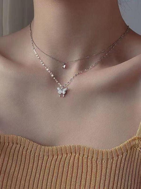 Double layer necklace with rhinestone butterfly pendant