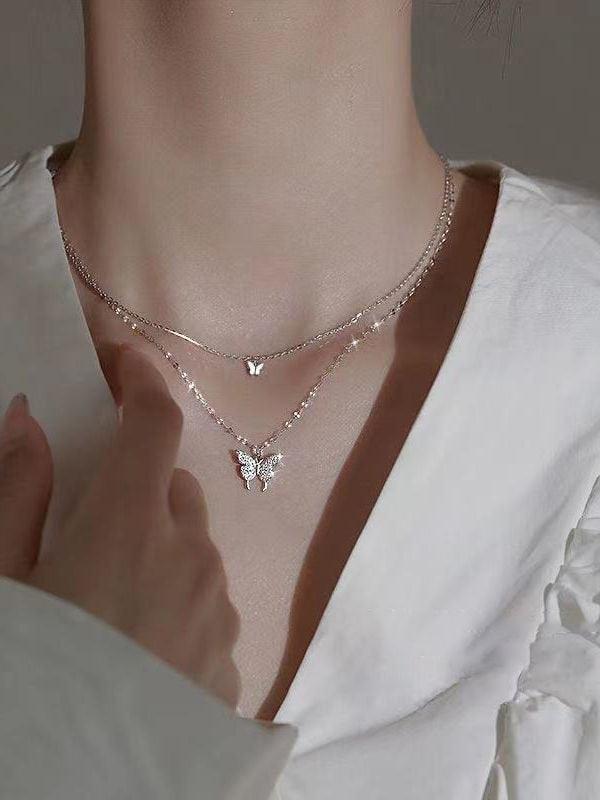Double layer necklace with rhinestone butterfly pendant