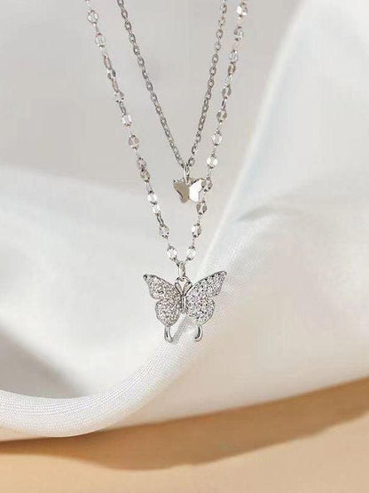 Double layer necklace with rhinestone butterfly pendant