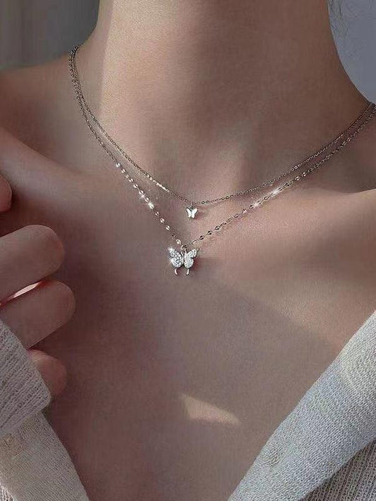 Double layer necklace with rhinestone butterfly pendant